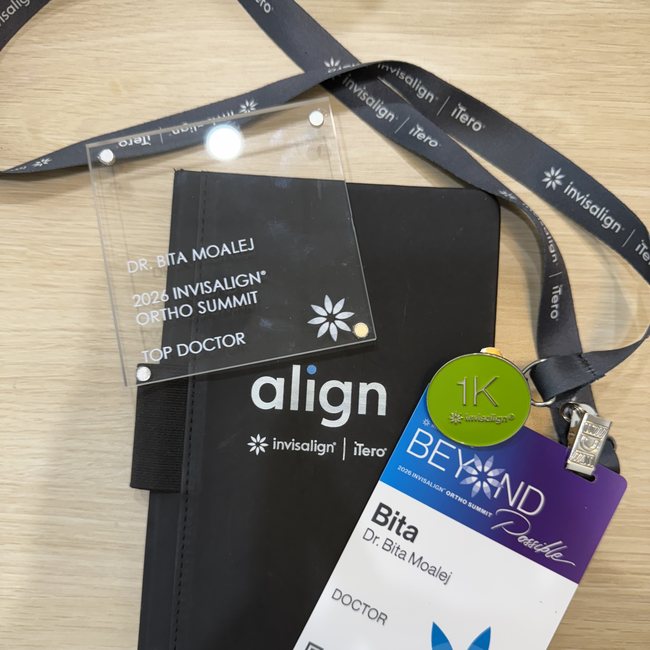 Dr. Bita Moalej's Top Doctor award and badge from the 2026 Invisalign Ortho Summit